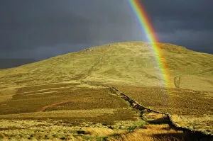 England, Northumberland, The Pennine Way. A rainbow above the Schil on the England England, Northumberland, The Pennine Way. A rainbow above the Schil on the England