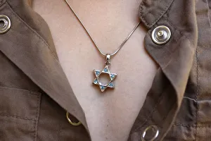 A 10-year-old girl wearing Star of David jewelry, Hertzliya, Israel, Middle East A 10-year-old girl wearing Star of David jewelry, Hertzliya, Israel, Middle East