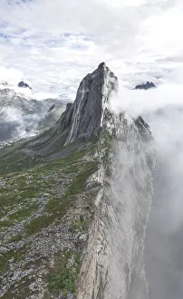 Aerial panoramic view of Mount Segla emerging from fog, Senja island, Troms county Aerial panoramic view of Mount Segla emerging from fog, Senja island, Troms county