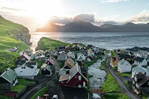 Denmark Collection: Aerial view of the coastal village of Gjogv and Kalsoy island at dawn, Eysturoy Island