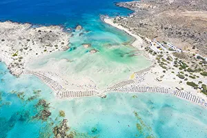 Aerial view of the equipped Elafonissi beach set in the unspoiled turquoise lagoon, Crete island, Greek Islands, Greece Aerial view of the equipped Elafonissi beach set in the unspoiled turquoise lagoon, Crete island, Greek Islands, Greece