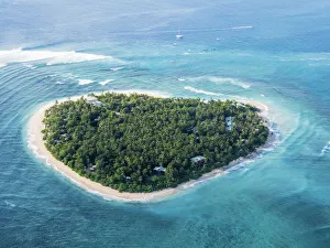 Aerial view of the heart-shaped island of Tavarua, near Viti Levu, Republic of Fiji Aerial view of the heart-shaped island of Tavarua, near Viti Levu, Republic of Fiji