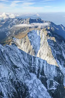 Prints of Aerial view of the north face of Piz Badile located between Masino and Bregaglia Valley, border of Italy and Switzerland, Europe Switzerland Prints: Piz Badile North Face Aerial Print