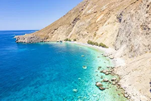 Aerial view of the scenic Glyka Nera beach by the crystal turquoise sea, Hora Sfakion, Crete island, Greek Islands Aerial view of the scenic Glyka Nera beach by the crystal turquoise sea, Hora Sfakion, Crete island, Greek Islands