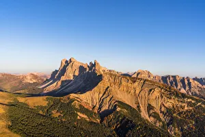 Aerial view of sunset over Seceda mountain in autumn, Cisles-Odle Nature Park, Dolomites Aerial view of sunset over Seceda mountain in autumn, Cisles-Odle Nature Park, Dolomites
