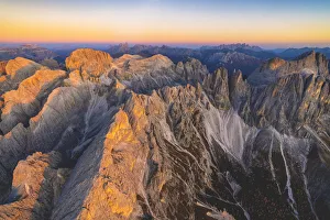 Aerial view of Torri Del Vajolet and Catinaccio Group lit by the autumn sunset, Dolomites Aerial view of Torri Del Vajolet and Catinaccio Group lit by the autumn sunset, Dolomites