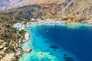 Aerial view of traditional whitewashed buildings of Loutro village and transparent sea, Crete island, Greek Islands Aerial view of traditional whitewashed buildings of Loutro village and transparent sea, Crete island, Greek Islands