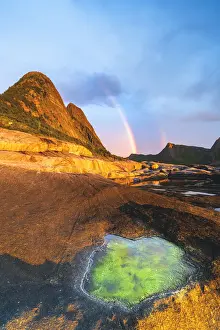 Midnight Sun Norway Prints: Algae inside rock formation on cliffs lit by rainbow during the midnight sun, Tungeneset
