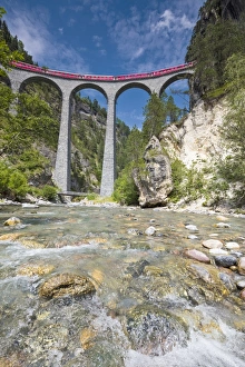 Alpine stream below the Bernina Express train on Landwasser Viadukt, Filisur, Albula Valley Alpine stream below the Bernina Express train on Landwasser Viadukt, Filisur, Albula Valley