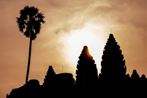 Angkor archaeological complex silhouetted against the rising sun, Angkor Angkor archaeological complex silhouetted against the rising sun, Angkor