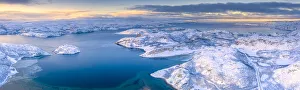 Arctic sunrise over the frozen sea and mountains covered with snow, Laksefjorden, Lebesby Arctic sunrise over the frozen sea and mountains covered with snow, Laksefjorden, Lebesby