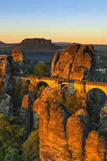 Bastei Bridge at sunrise, Lilienstein Mountain, Elbsandstein Mountains, Saxony, Germany Bastei Bridge at sunrise, Lilienstein Mountain, Elbsandstein Mountains, Saxony, Germany