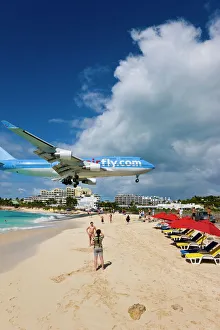 Beach at Maho Bay and low flying aircraft approaching the runway of Princess Juliana International airport, St Beach at Maho Bay and low flying aircraft approaching the runway of Princess Juliana International airport, St
