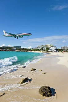 Beach at Maho Bay and low flying aircraft approaching the runway of Princess Juliana International airport, St Beach at Maho Bay and low flying aircraft approaching the runway of Princess Juliana International airport, St