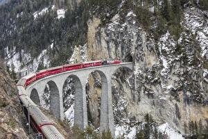 Bernina Express passes over Landwasser Viaduct, UNESCO World Heritage Site Bernina Express passes over Landwasser Viaduct, UNESCO World Heritage Site