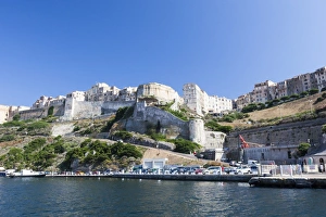 Blue sea frames the medieval old town and fortress, Bonifacio, Corsica, France Blue sea frames the medieval old town and fortress, Bonifacio, Corsica, France