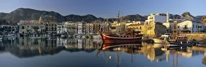 The boat filled harbour and mountains with mirror reflection, Kyrenia (Girne) The boat filled harbour and mountains with mirror reflection, Kyrenia (Girne)