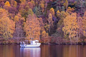 Boat moored at Loch Katrine, autumn colours, The Trossachs, Scotland, United Kingdom Boat moored at Loch Katrine, autumn colours, The Trossachs, Scotland, United Kingdom