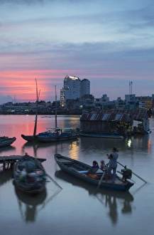 Boats on Can Tho River at sunset, Can Tho, Mekong Delta, Vietnam, Indochina Boats on Can Tho River at sunset, Can Tho, Mekong Delta, Vietnam, Indochina