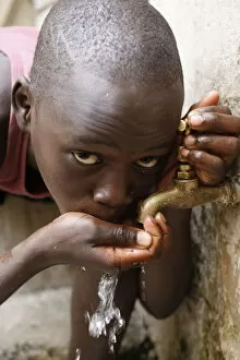 Dakar Collection: Boy drinking water, Dakar, Senegal, West Africa, Africa