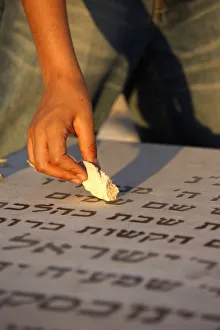 Boy placing stone on a grave in the Mount of Olives Jewish cemetery, Jerusalem, Israel Boy placing stone on a grave in the Mount of Olives Jewish cemetery, Jerusalem, Israel