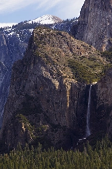 Bridal Veil Falls and Half Dome Peak in Yosemite Valley Bridal Veil Falls and Half Dome Peak in Yosemite Valley
