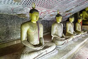 Dambulla Cave Temple Prints: Buddha figures inside Dambulla cave Buddhist temple complex