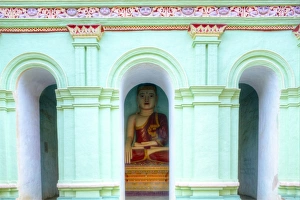 Buddha inside a cave temples on Shwe Ba Hill on the west bank of Chindwin River near Pho Win Hill Buddha inside a cave temples on Shwe Ba Hill on the west bank of Chindwin River near Pho Win Hill