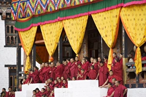 Buddhist monks watching festival (Tsechu), Trashi Chhoe Dzong, Thimphu, Bhutan, Asia Buddhist monks watching festival (Tsechu), Trashi Chhoe Dzong, Thimphu, Bhutan, Asia