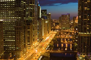 Buildings along Wacker Drive and the Chicago River at dusk, Chicago, Illinois Buildings along Wacker Drive and the Chicago River at dusk, Chicago, Illinois