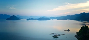 A calm view of southeast Qiandao Lake in Zhejiang province at dusk, Zhejiang, China, Asia A calm view of southeast Qiandao Lake in Zhejiang province at dusk, Zhejiang, China, Asia