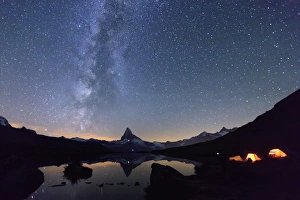 Camping under the stars and Milky Way with Matterhorn reflected in Lake Stellisee Camping under the stars and Milky Way with Matterhorn reflected in Lake Stellisee