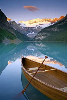 Canoe on Lake Louise at Sunrise, Lake Louise, Banff National Park, Alberta, Canada Canoe on Lake Louise at Sunrise, Lake Louise, Banff National Park, Alberta, Canada