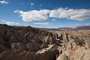 A car passes through the stunning rock formations of the Quebrada de las Flechas A car passes through the stunning rock formations of the Quebrada de las Flechas