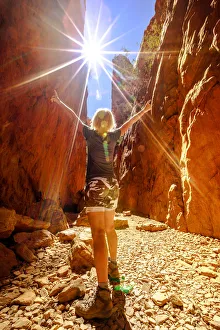 Carefree tourist woman enjoying the picturesque natural alleyway of Standley Chasm Carefree tourist woman enjoying the picturesque natural alleyway of Standley Chasm