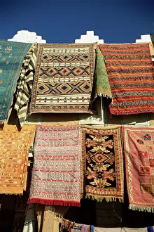 Carpets for sale outside shop in frontier town of Agdz Carpets for sale outside shop in frontier town of Agdz