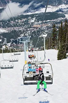 Chairlift with skiers, Whistler mountain resort, venue of the 2010 Winter Olympic Games Chairlift with skiers, Whistler mountain resort, venue of the 2010 Winter Olympic Games