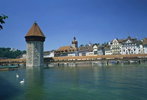 The Chapel Bridge and Water Tower with the city of Lucerne beyond The Chapel Bridge and Water Tower with the city of Lucerne beyond