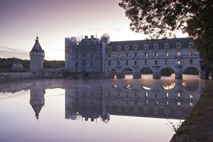 The chateau of Chenonceau reflecting in the waters of the River Cher at dawn, Indre-et-Loire The chateau of Chenonceau reflecting in the waters of the River Cher at dawn, Indre-et-Loire