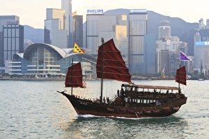 Chinese junk boat sails on Victoria Harbour, Hong Kong, China, Asia Chinese junk boat sails on Victoria Harbour, Hong Kong, China, Asia