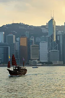 Chinese sailing junk on Victoria Harbour, the skyline of Central, Hong Kong Island beyond, Hong Kong, China, Asia Chinese sailing junk on Victoria Harbour, the skyline of Central, Hong Kong Island beyond, Hong Kong, China, Asia