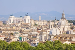 Churches and domes of the Rome skyline showing Victor Emmanuel II monument in the distance Churches and domes of the Rome skyline showing Victor Emmanuel II monument in the distance