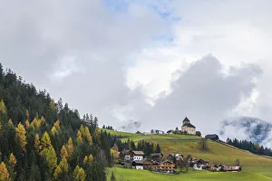 Ciastel de Tor surrounded by woods in autumn, San Martino in Badia, Val Badia, Dolomites Ciastel de Tor surrounded by woods in autumn, San Martino in Badia, Val Badia, Dolomites