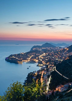 The city lights at sunset over the old town of Dubrovnik, UNESCO World Heritage Site The city lights at sunset over the old town of Dubrovnik, UNESCO World Heritage Site