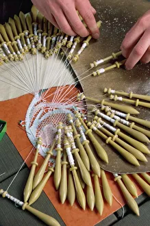 Close-up of hands and bobbins for lace making at Le Puy in the Auvergne, France, Europe Close-up of hands and bobbins for lace making at Le Puy in the Auvergne, France, Europe