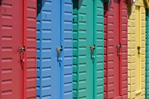 Close-up of multicoloured beach huts on the long sweeping beach of Llanbedrog Close-up of multicoloured beach huts on the long sweeping beach of Llanbedrog