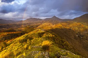 Cnicht under a rainbow at sunset, Snowdonia National Park, North Wales, Wales, United Kingdom Cnicht under a rainbow at sunset, Snowdonia National Park, North Wales, Wales, United Kingdom