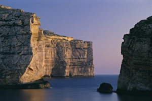 Mediterranean Sunset Prints: Coastline in the evening at Dwejra
