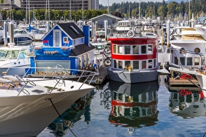 Colourful boats in Vancouver Harbour near the Convention Centre, Vancouver, British Columbia Colourful boats in Vancouver Harbour near the Convention Centre, Vancouver, British Columbia