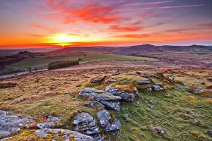 A colourful dawn on Chinkwell Tor in Dartmoor National Park, Devon, England A colourful dawn on Chinkwell Tor in Dartmoor National Park, Devon, England